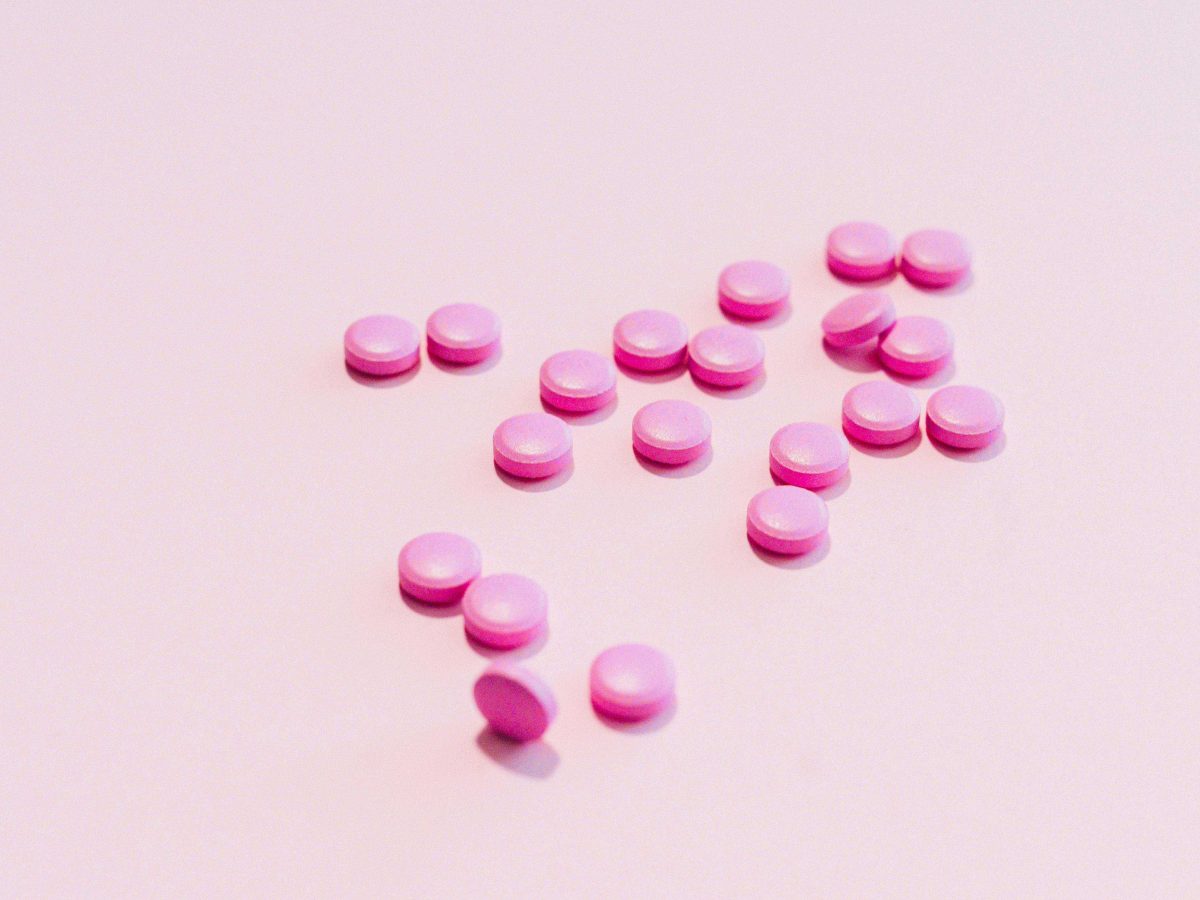 Pink Medication Pill on White Surface