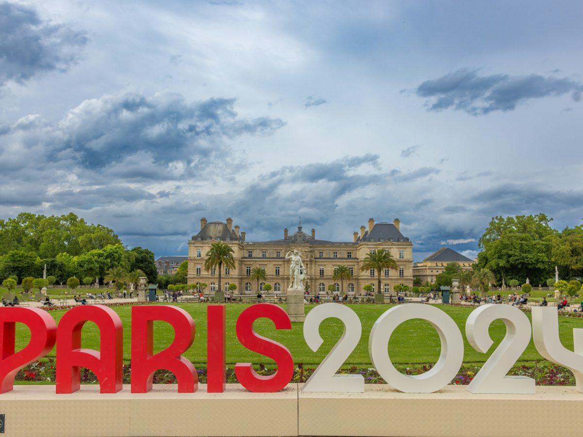 Paris2024 text, French park in background. Credit to Solen Feyissa.